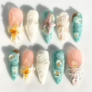 3D conch shell press on nails in teal and peach with sculpted sea foam coral texture starfish gold foil and hibiscus bloom