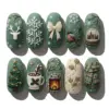 3D Cottagecore Christmas Press On Nails | Green Winter Fake Nails | SE88 10 Sage green 3D cottagecore Christmas press on nails with sculpted reindeer, snow globe, fireplace, hot cocoa mug, robin bird, Christmas tree, bow and plaid scarf designs