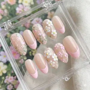 3D daisy French tip press on nails with pink curved tips, sculpted white and pink daisy clusters, hand-painted tulips and wildflowers on nude base for spring