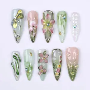 3D dragonfly aurora glass press on nails with gold arch flower, hand-painted magnolias, chrome green drip, pink floral charms and sage mint glitter for spring