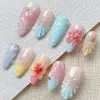 3D floral shell press on nails in pastel pink blue lilac and yellow with hibiscus blooms and pearl accents