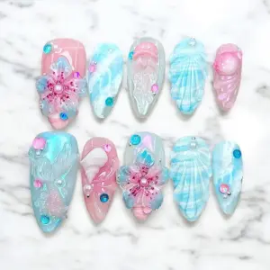 3D floral shell press on nails in pink and blue pearl shimmer with iridescent sequins and crystal rhinestones