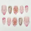3D floral wedding press on nails in blush pink with gold accents and pearl details