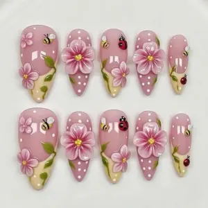 3D pink flower press on nails with polka dots, honeybees, ladybugs and green leaves on dusty pink and cream base for spring