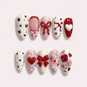 Luxury 3D Valentine's Day press on nails with sculpted rose bouquet, red bow, lace texture, cupid arrow, white heart and gold stud details in red white and pink