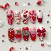Luxury 3D Valentine's Day press on nails with sweetheart XOXO, cherry, chocolate, bow, rhinestone heart and candy cane designs in red and pink