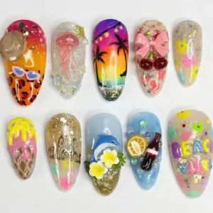 Maximalist tropical press on nails featuring hand-painted palm tree sunset, 3D dolphin with plumeria flowers, gold aloha script on glitter base, 3D pink bow with cherries, jellyfish charm, leopard print with sunglasses, ice cream art, and colorful beach letter nails