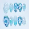 Blue Ocean Press On Nails 3D Shell Starfish Floral Summer Fake Nails | SE54 4 Blue ocean press on nails with 3D sculptured white seashell, 3D starfish charm, white 3D floral bloom with pearl bead, hand-painted seahorse and seaweed line art, gold shimmer base, and silver rhinestones on aqua summer fake nails
