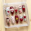 Cute Valentine's Day cartoon press on nails with beagle dog, boy, girl, yellow bird characters, XOXO, hearts, paw prints and 3D heart gem in a clear nail box