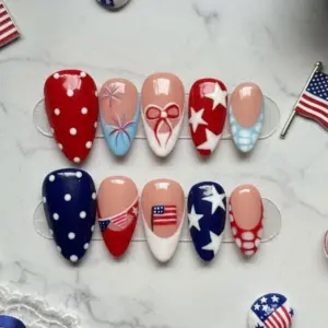 Coquette bow patriotic press on nails with red white blue polka dots stars fireworks and American flag design for 4th of July