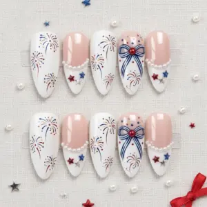 Elegant coquette bow fireworks press on nails with pearl chain red blue star charms on white blush base for 4th of July