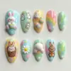 Cute Easter 3D Press On Nails Rainbow Bunny Cartoon Fake Nails | EV30 3 Cute Easter press on nails with 3D white bunny, sculpted Easter eggs, daisy, bunny bottom, cartoon bunnies and rainbow ombre on pastel blue yellow mint and pink bases