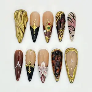Dark glam stiletto press on nails with melted gold chrome, brown tortoiseshell, black base, 3D flower and rhinestone details