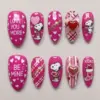 Hot pink Valentine's Day press on nails with cartoon dog, hearts, XOXO, cupid arrow, 3D bow and pearl heart gem details