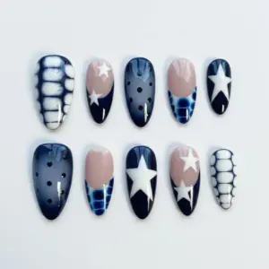 Navy blue Y2K press on nails with white star motifs, nude French tips, tie dye pattern, black polka dots, electric blue scale texture, and white grid line detail
