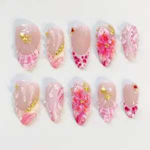 Blush pink press on nails with hand-painted fuchsia hibiscus bloom with orange stamen, swirling pink marble wave patterns, transparent bubble gel bead accents, gold micro-ball bead trails, gold shell charm, red crystal rhinestone, and shell fan relief texture on romantic summer fake nails