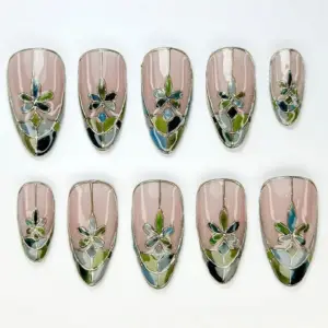 Stained glass floral press on nails in blush pink with silver lead lines, green and blue mosaic petals and chrome mirror tips