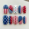 Bold graphic American flag stars and stripes press on nails in red white and navy blue for 4th of July Independence Day