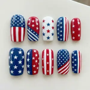 Bold graphic American flag stars and stripes press on nails in red white and navy blue for 4th of July Independence Day