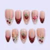 Strawberry French press on nails with 3D strawberry and cherry charms, white lace dot details, pink hibiscus flower, fairy silhouette, and deep red French tips
