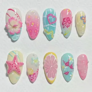 Colorful summer press on nails with 3D pink starfish, 3D lemon slice, heart pool art, hibiscus florals, rainbow butterfly, bikini illustration, and sprinkle dot patterns in pink, mint, and yellow fake nails