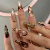 Tortoiseshell 3D Floral Press On Nails Brown Gold Fake Nails | EV19 4 Tortoiseshell and 3D floral stiletto press on nails with gold chrome, pearl and rhinestone details on hand