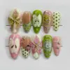 Y2K retro press on nails with 3D pink lily flower, ladybug charm, polka dots, abstract butterfly, silver swirl and pink plaid for spring
