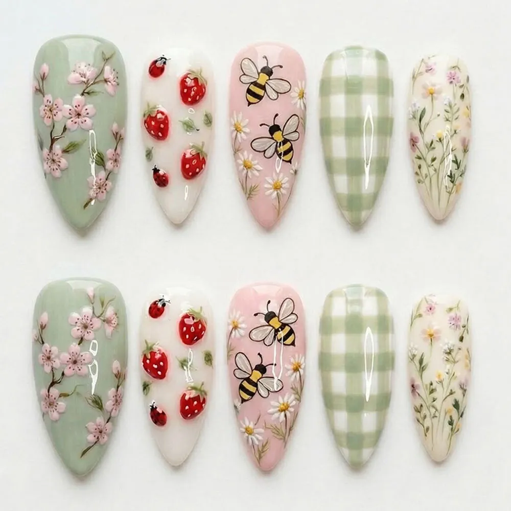 Cottagecore press on nails with strawberries, ladybugs, honeybees, daisies, cherry blossoms, gingham and wildflowers in sage green and pink for spring