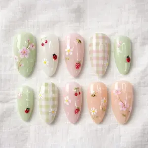 Cottagecore press on nails with 3D ladybugs, honeybees, strawberries, daisies, cherry blossoms and gingham in sage green, pink and peach for spring